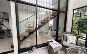 Glass Fitting Dog Door installed in a glass aluminium frame